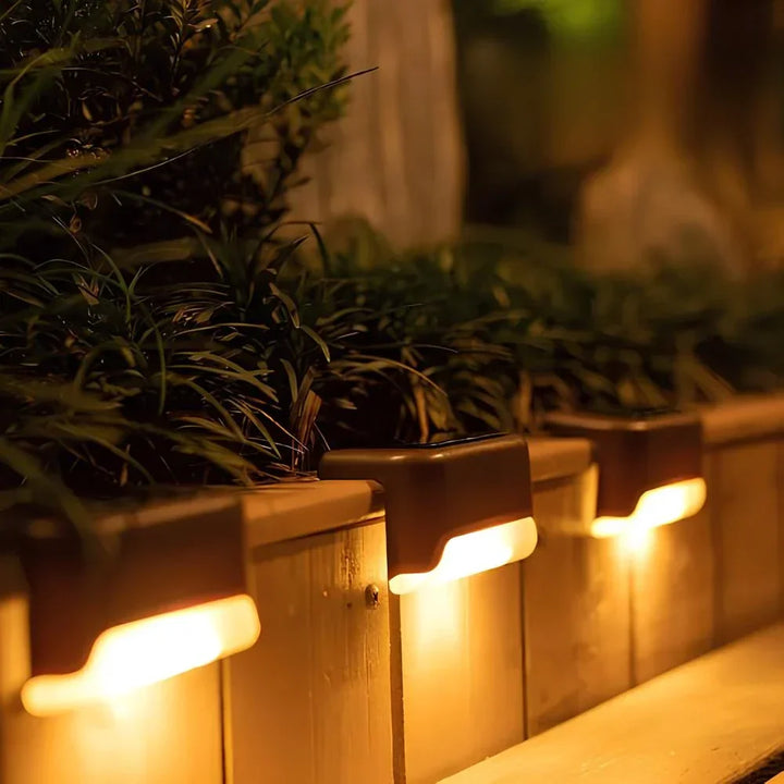 Weatherproof Nvroome solar step lights, warm LED glow for decks.