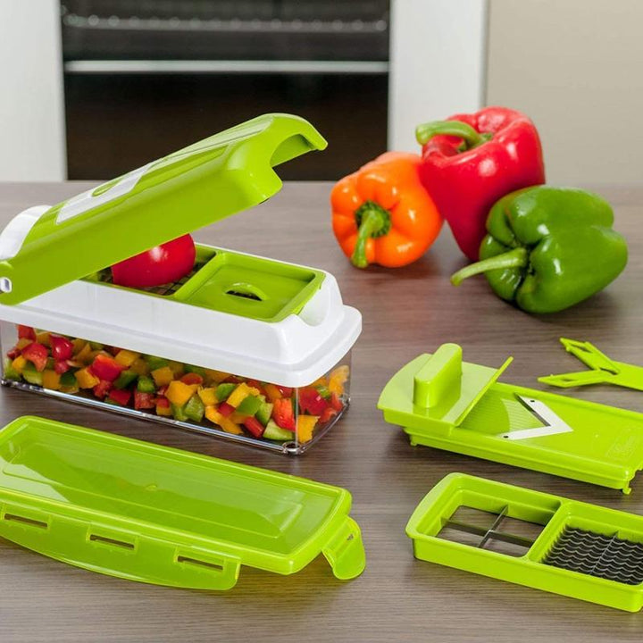 Manual vegetable chopper & slicer with interchangeable blades for precise dicing and grating of veggies.
