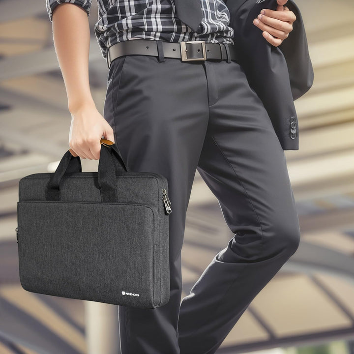 Travel-friendly water-resistant shoulder bag for laptops, 360° protective design.