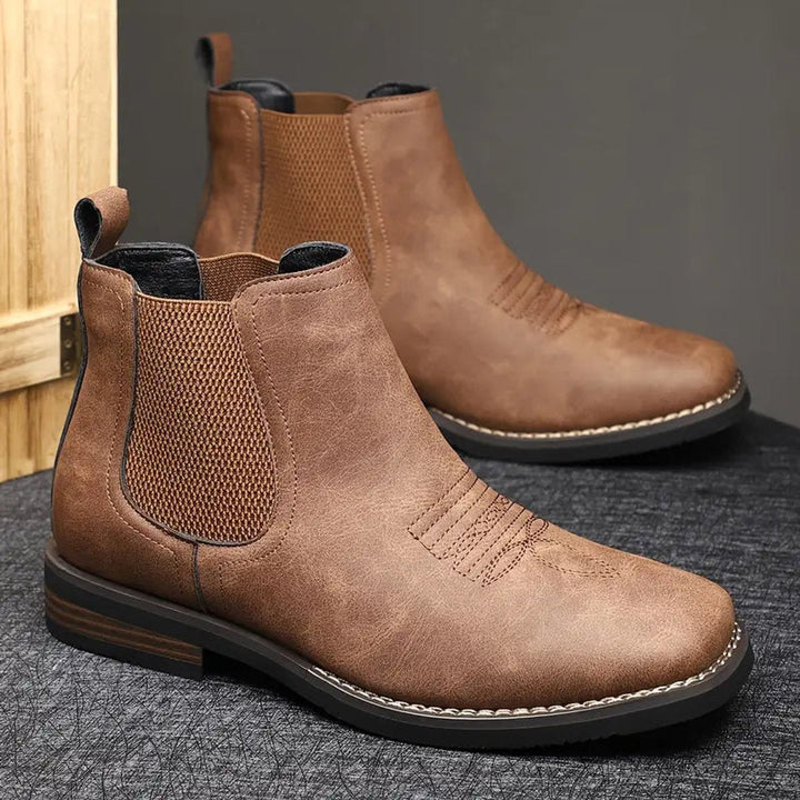 Men's elegant slip-on Chelsea ankle boots, ideal for dress or casual wear. Comfortable and durable fashion.