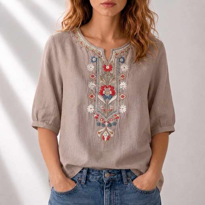 Chic women's blouse with beautiful floral embroidery. Casual elegant style, perfect for spring/summer.