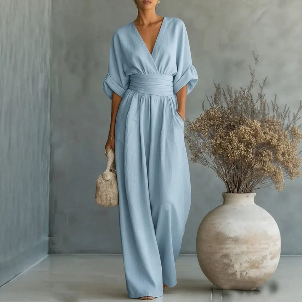 Women's V-neck short sleeve jumpsuit in a solid color, offering a comfortable and chic wide leg silhouette.