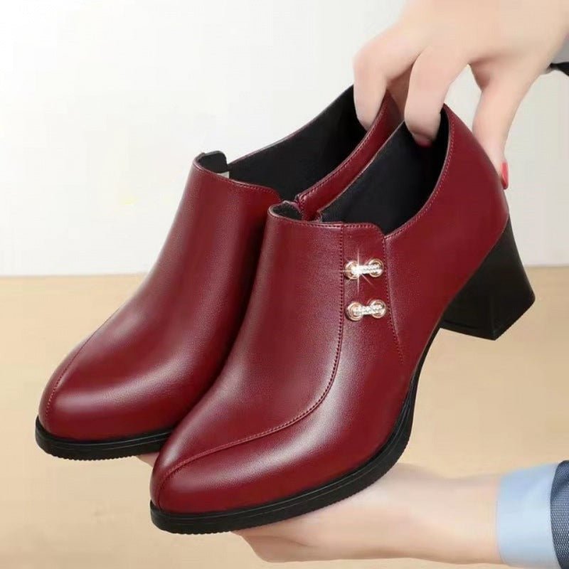 Women's leather ankle boots featuring a comfortable block heel, rounded toe, and convenient side zipper.