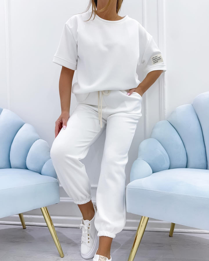 Stylish women's short sleeve set, perfect for comfortable lounging & elegant summer casualwear.