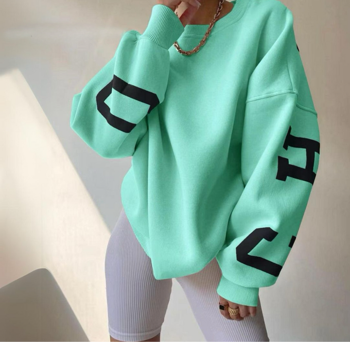 Relaxed fit women's sweatshirt, everyday essential, trendy & ultimate comfort.