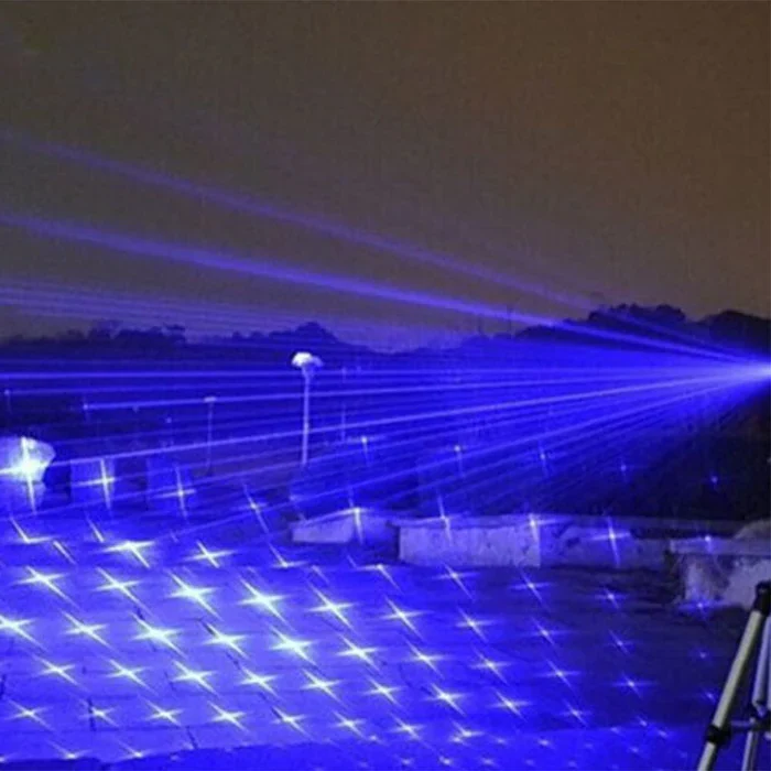 Rechargeable laser flashlight with focused beam. High-power outdoor lamp, essential for camping, hiking, & survival.