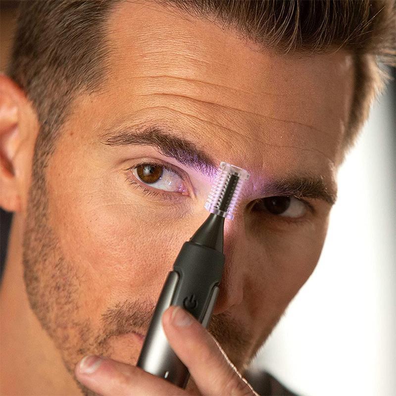 Man using a Precision Trimmer with LED light to perfectly shape his beard and facial hair.