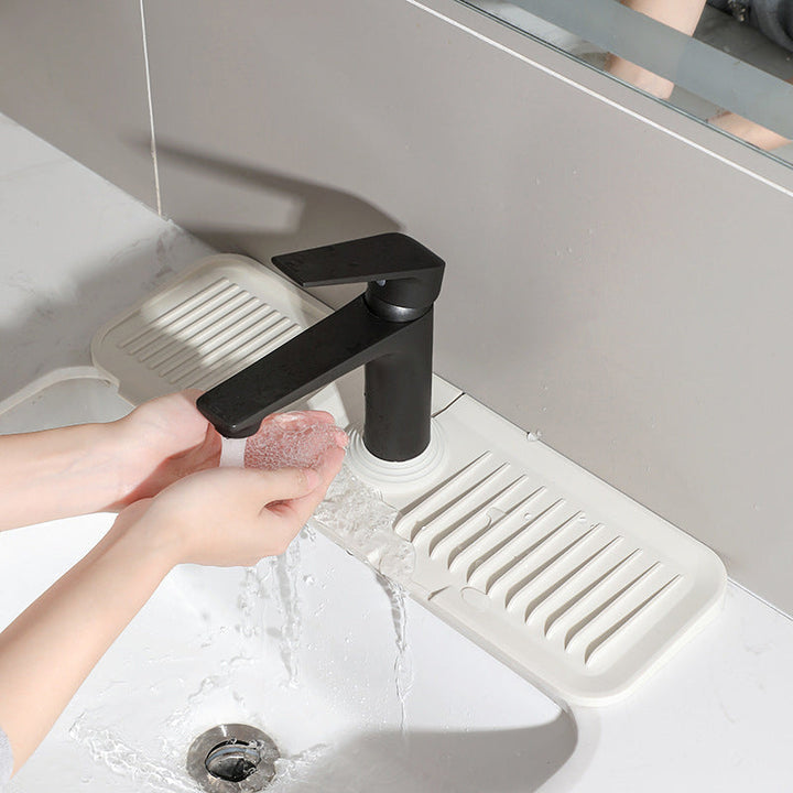 Durable, non-slip silicone mat protects kitchen countertops from water, heat, and scratches.