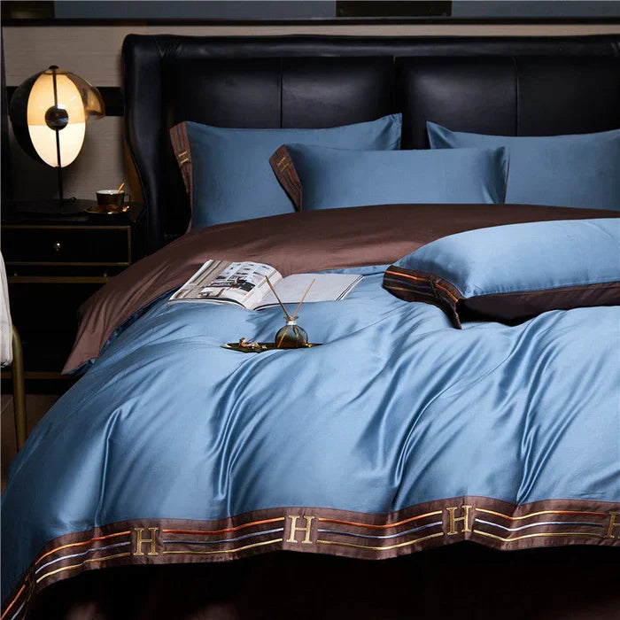 High-quality embroidered cotton bedding set, offering soft comfort and elegant bedroom aesthetic.