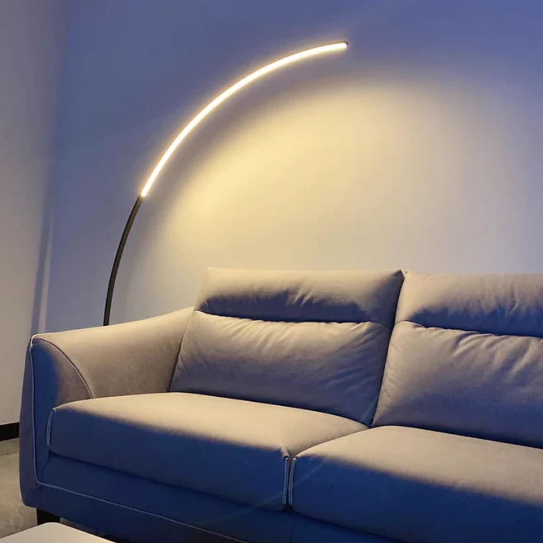Minimalist black metal LED floor lamp. Contemporary design perfect for modern home decor in living rooms or bedrooms.