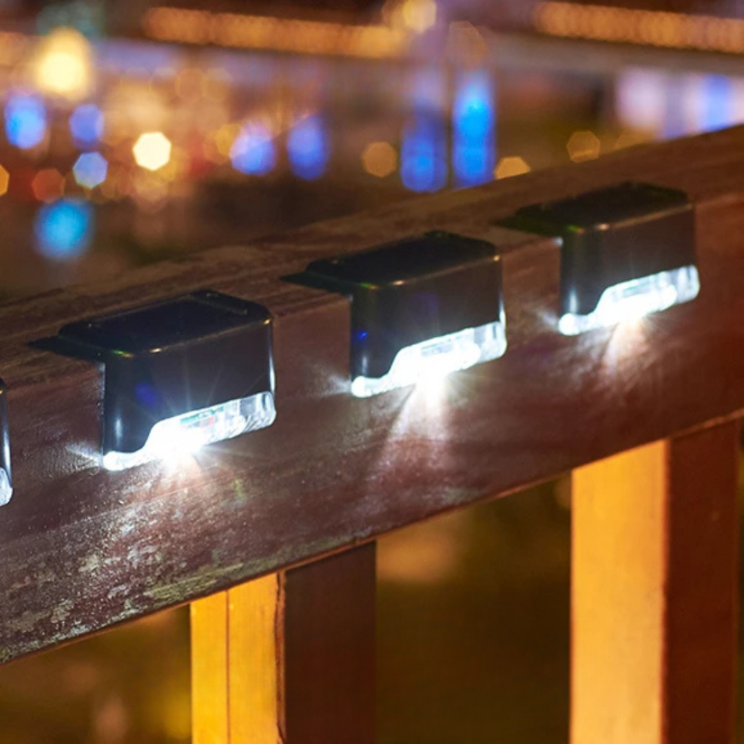Self-adhesive solar LED step lights illuminate outdoor stairs & garden pathways with energy-saving glow.