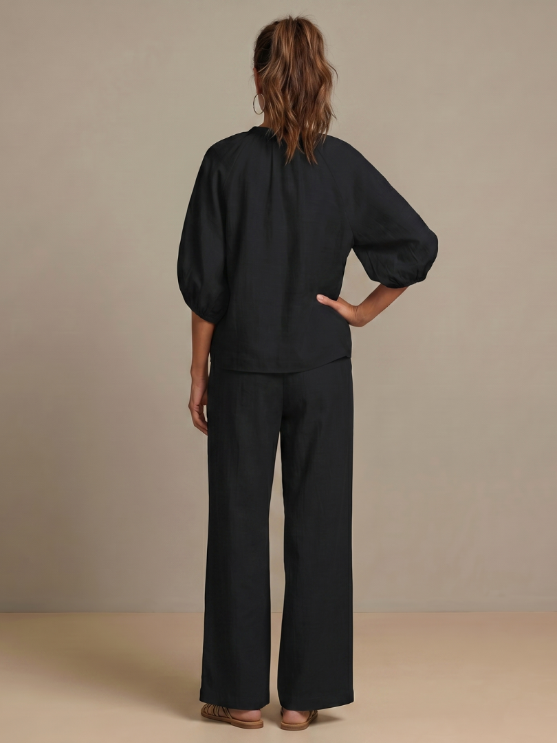 Versatile women's two-piece for spring/summer: zip-front top, wide-leg pants.