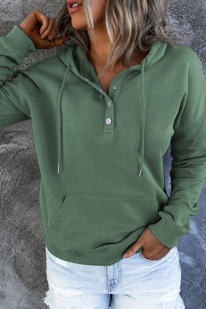 Neatly folded women's casual hoodie sweater, perfect for travel & everyday comfort.