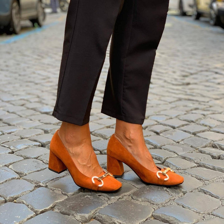 Classic slip-on women's loafers with a wide heel & metallic accent. Versatile, comfortable, elegant footwear for work or casual chic.