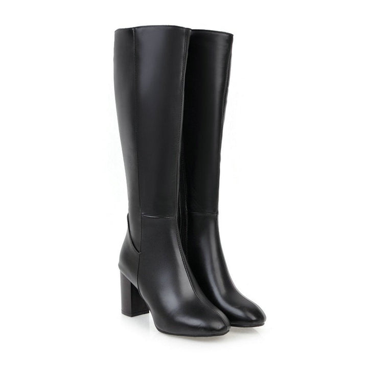Versatile women's knee-high leather block heel boots. Stylish for dress or casual wear, featuring a side zipper.