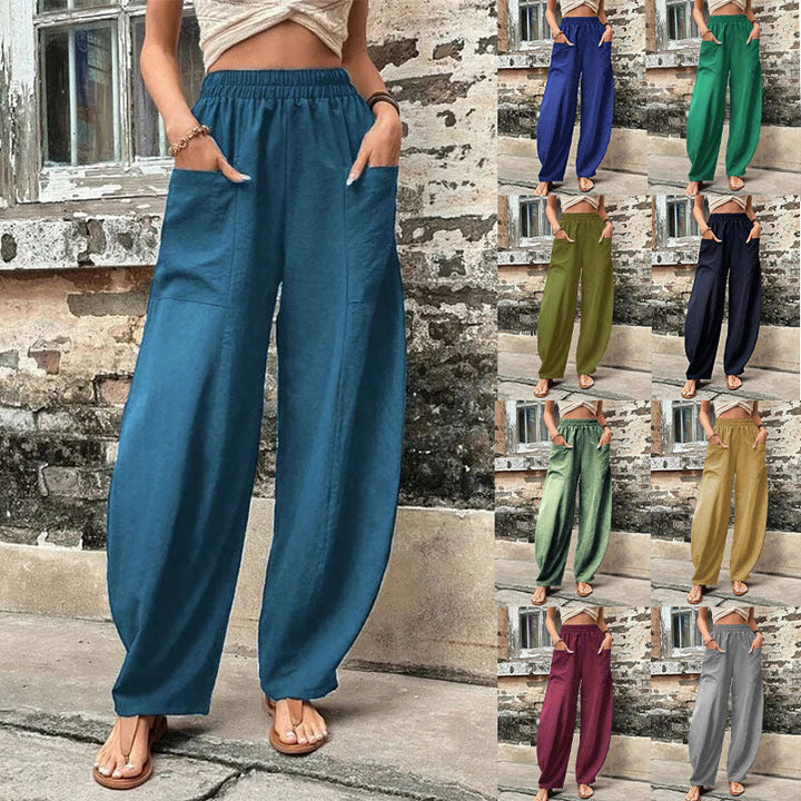 Women's wide-leg palazzo trousers with pockets, showing flowing silhouette, ideal for comfortable casual wear.