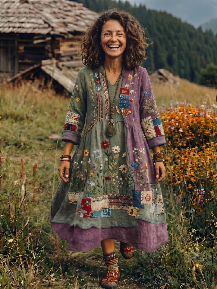 Women's elegant embroidered panel long sleeve midi dress, highlighting relaxed fit and beautiful flowy design.