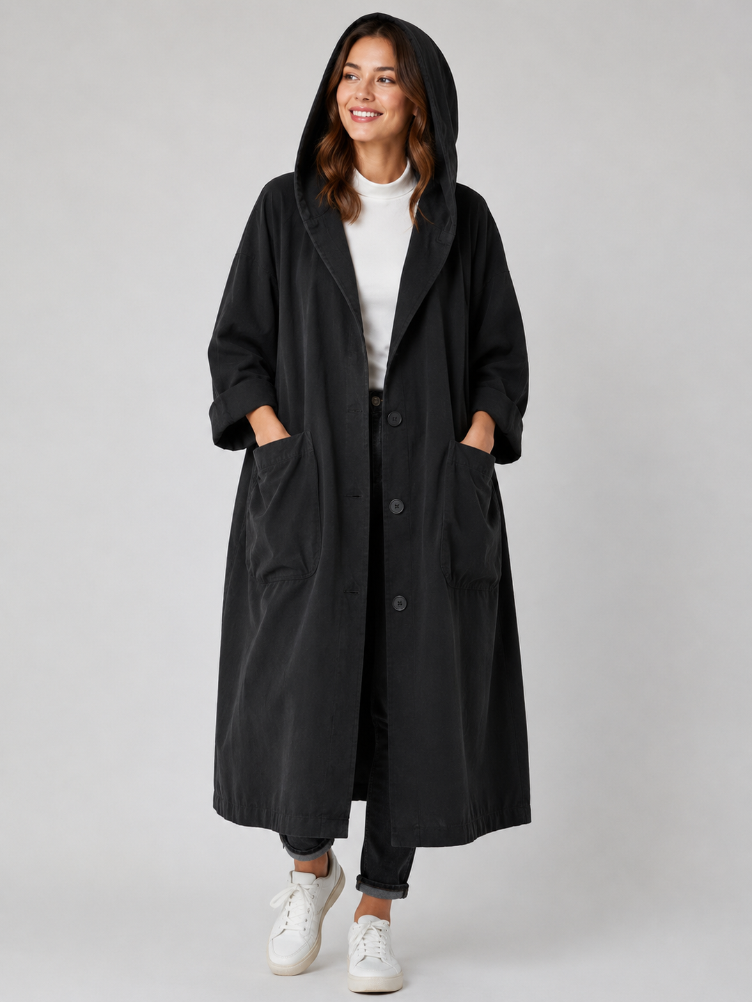 Fashionable women's waterproof long trench coat, an all-season outerwear essential for ladies.