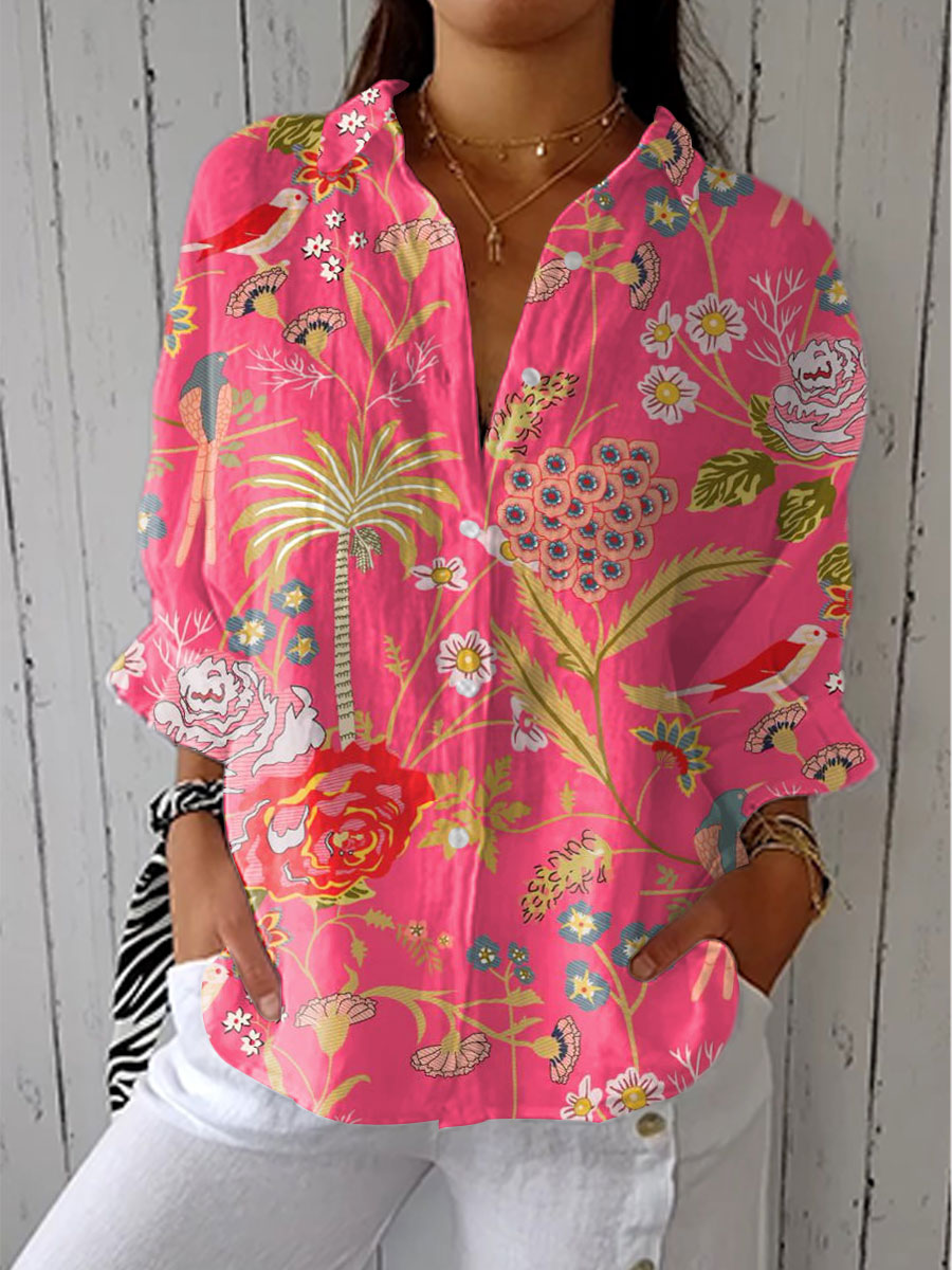 Women's vibrant tropical floral print V-neck blouse, perfect for summer holidays and resort wear.