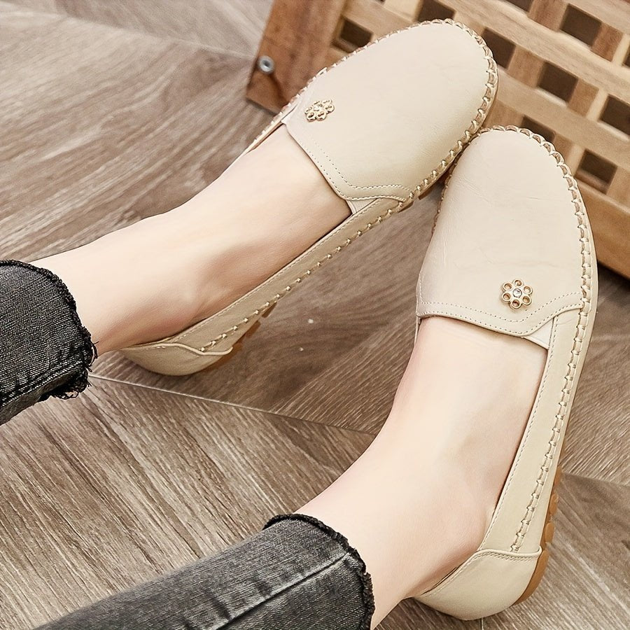 Stylish women's black slip-on loafers offering superior comfort for work or casual outfits. Flexible fit.