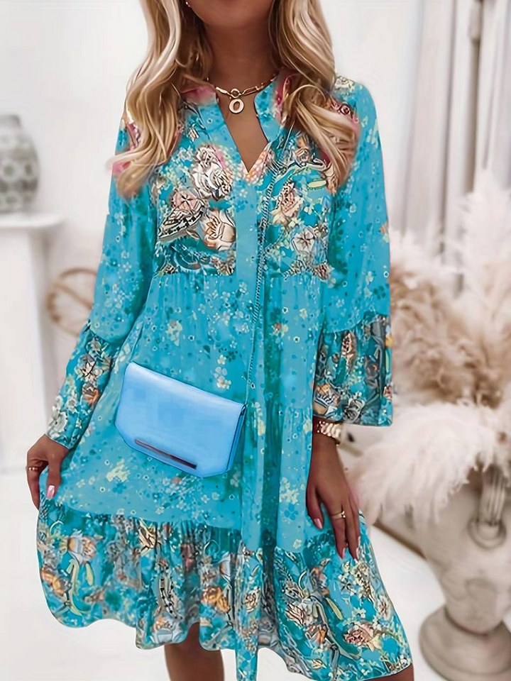 Bohemian floral long sleeve women's dress with ruffle hem, offering stylish comfort for free-spirited casual looks.