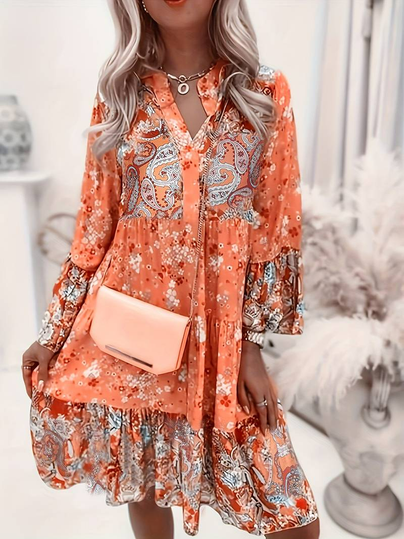 Elegant women's long sleeve floral bohemian dress featuring a beautiful ruffle hem, ideal for casual and vacation.