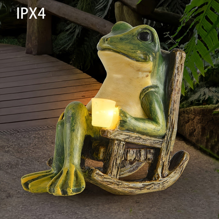 Weather-resistant resin frog statue with solar LED light, ideal patio accent & enchanting garden decor.