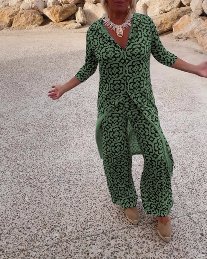 Vacation-ready women's printed V-neck tunic and wide-leg pants outfit, a comfy two-piece set.