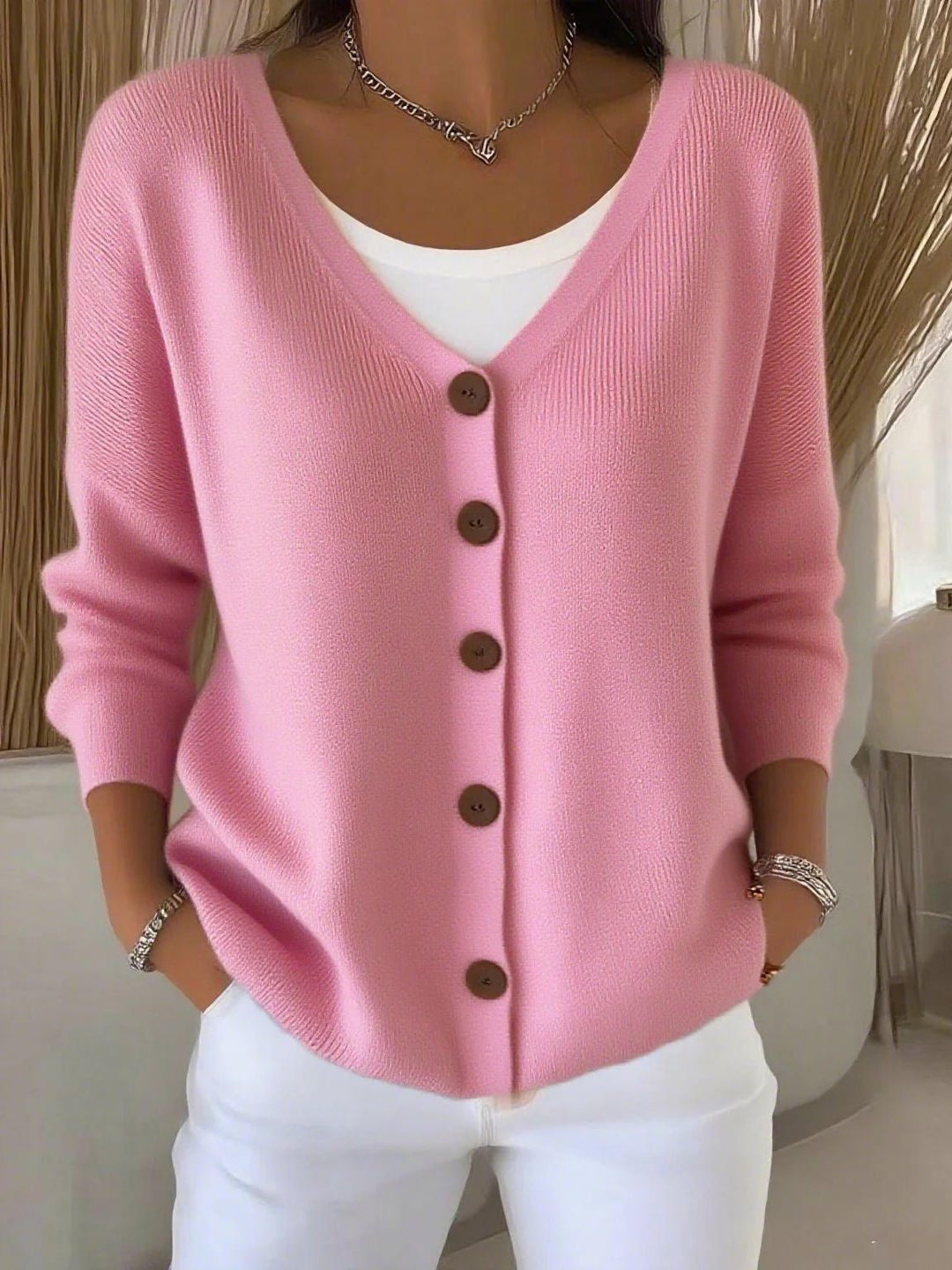 Modern women's V-neck button-up knit cardigan, a chic long-sleeve sweater for versatile fashion and everyday comfort.