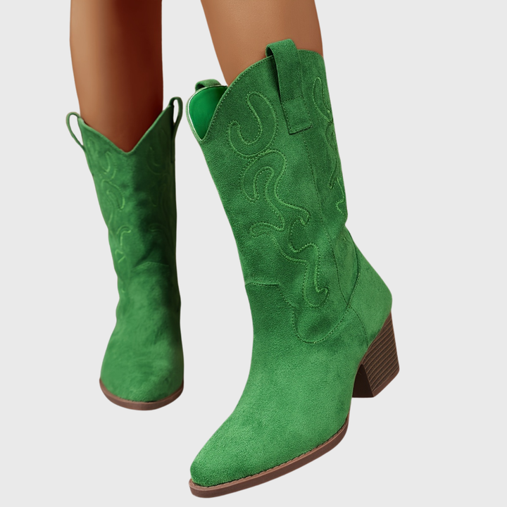 Woman wearing comfortable wide-calf western cowboy boots, stylish for casual outings.