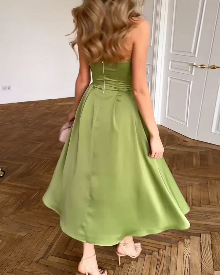 Fashionable women's green strapless dress, an elegant design for evening wear and formal events. Stylish party gown.