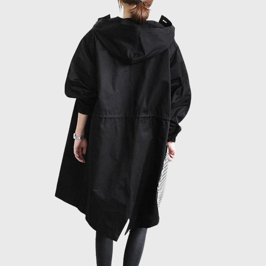 Functional women's long hooded trench coat, water-resistant for reliable weather protection & versatile style.