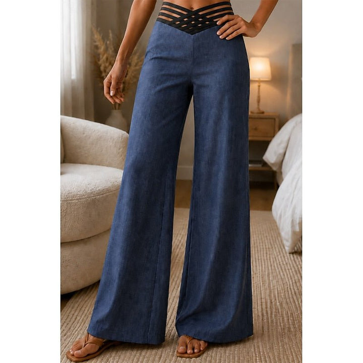 Elegant women's high-waist wide-leg trousers in a flowy fabric, perfect for chic spring & summer outfits.
