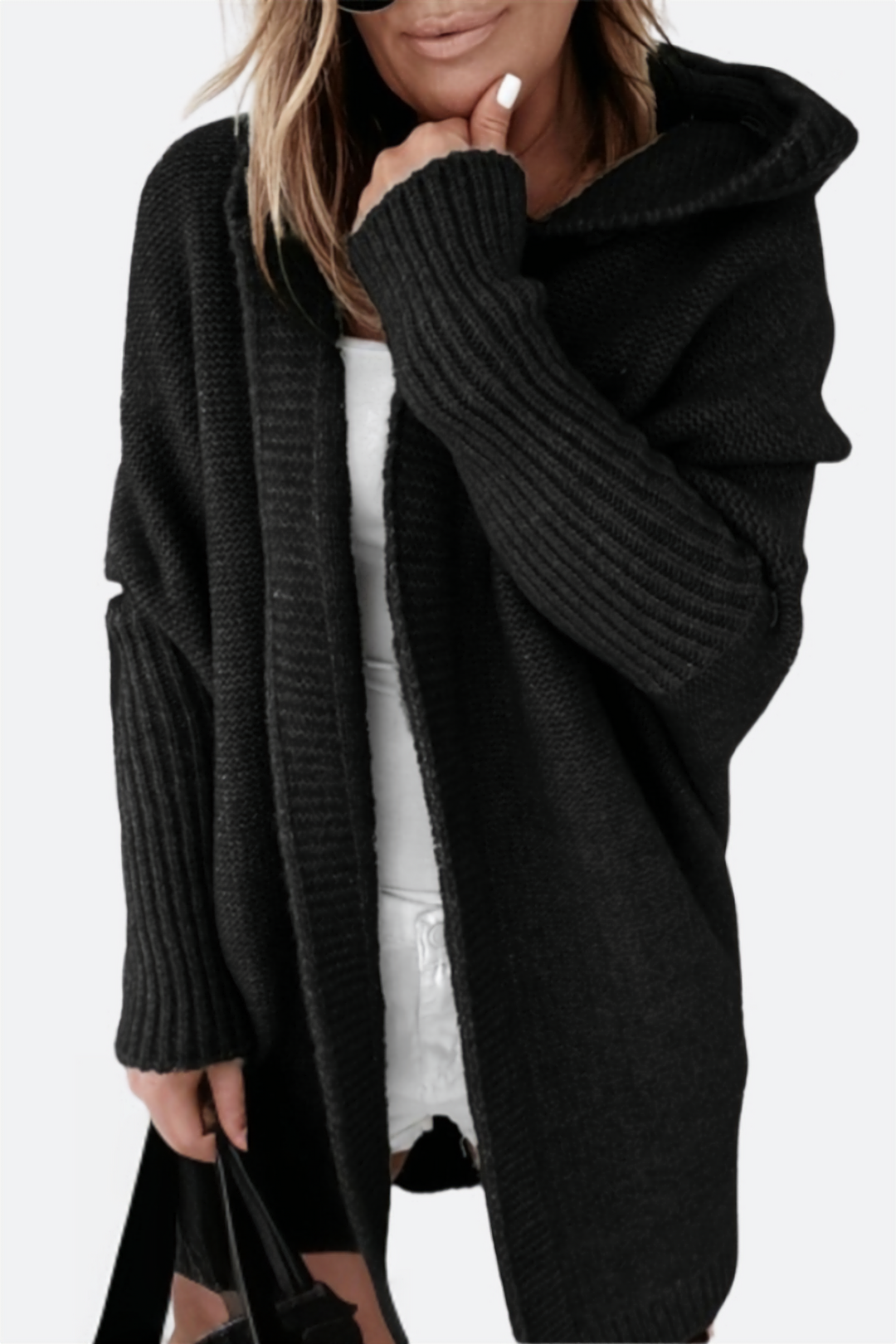 Chic women's oversized hooded knit cardigan, a versatile piece for cozy and casual outfits.