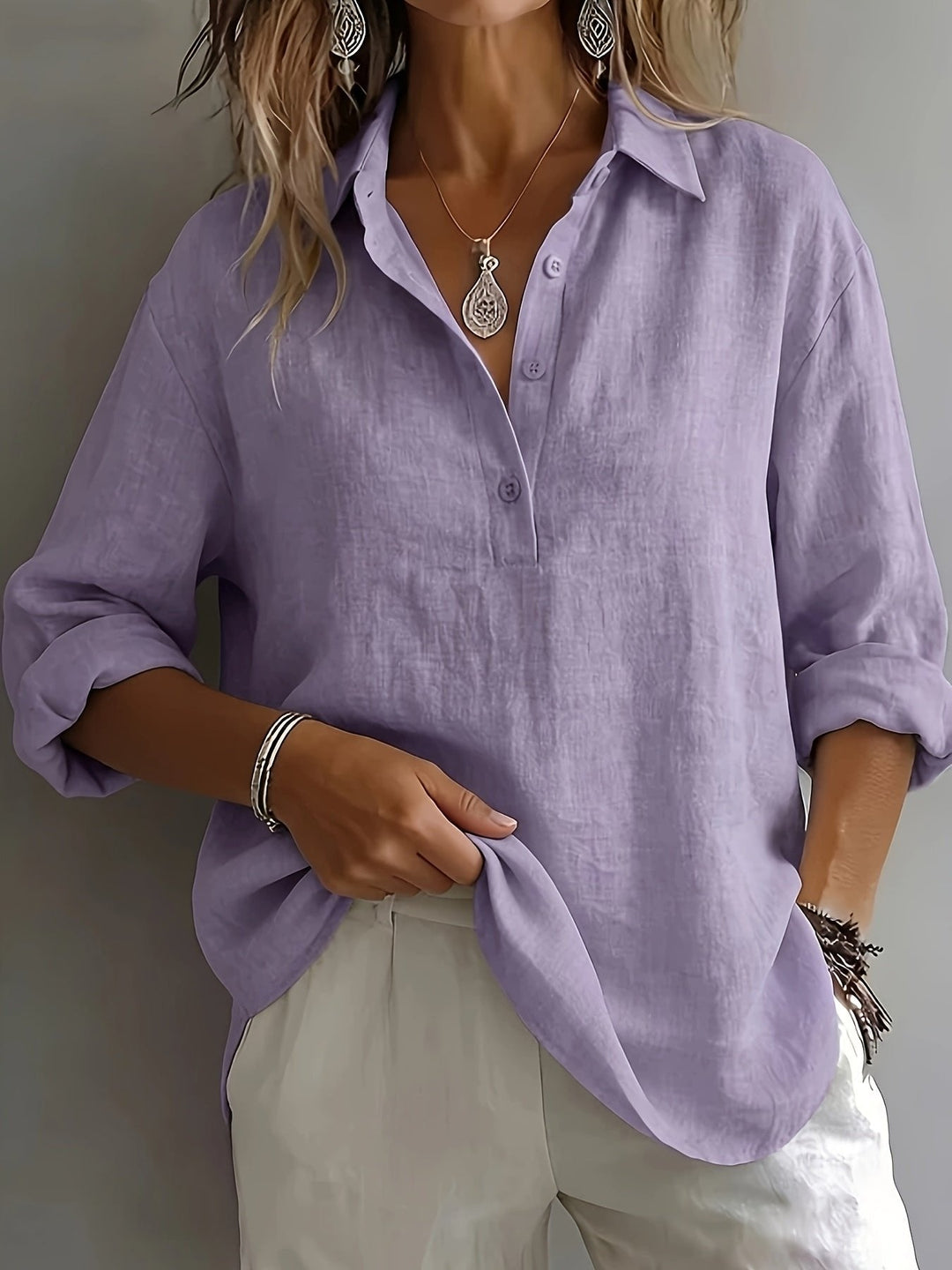 Relaxed fit women's collared blouse. Versatile long sleeve button-up top for any occasion.