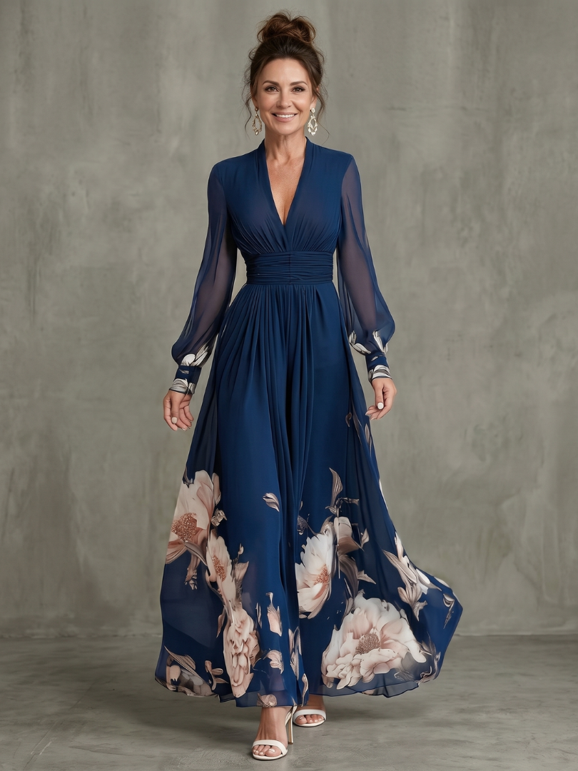 Navy pleated maxi dress with elegant sheer sleeves and a flattering V-neck, perfect for evening wear.