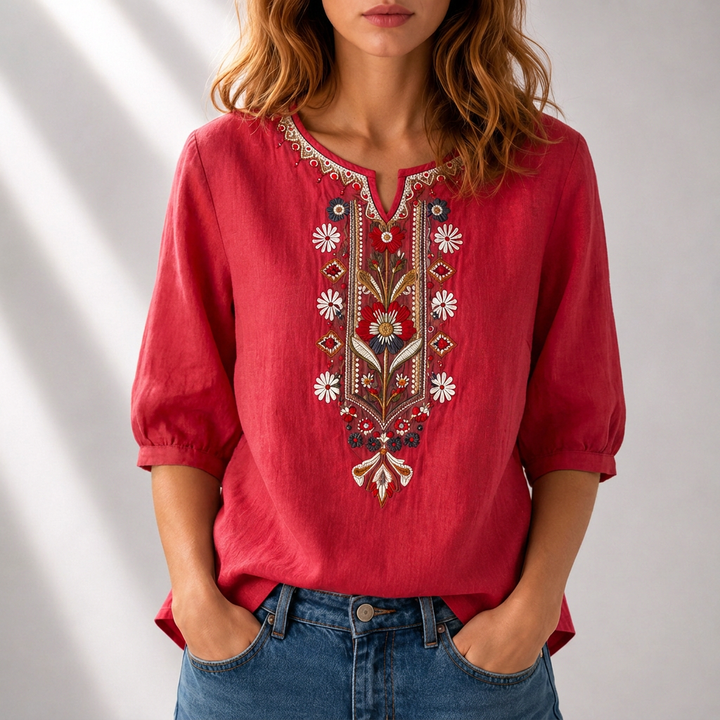 Elegant women's blouse, intricate floral embroidery details. Perfect spring fashion for a relaxed fit look.
