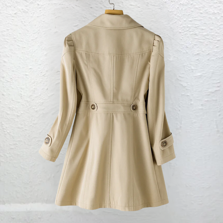 Chic women's button-front trench coat, elegant vintage style for sophisticated fall & spring outerwear.