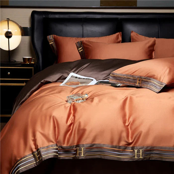 Delicate embroidered pattern on a premium cotton duvet cover, part of a luxurious bedding collection.