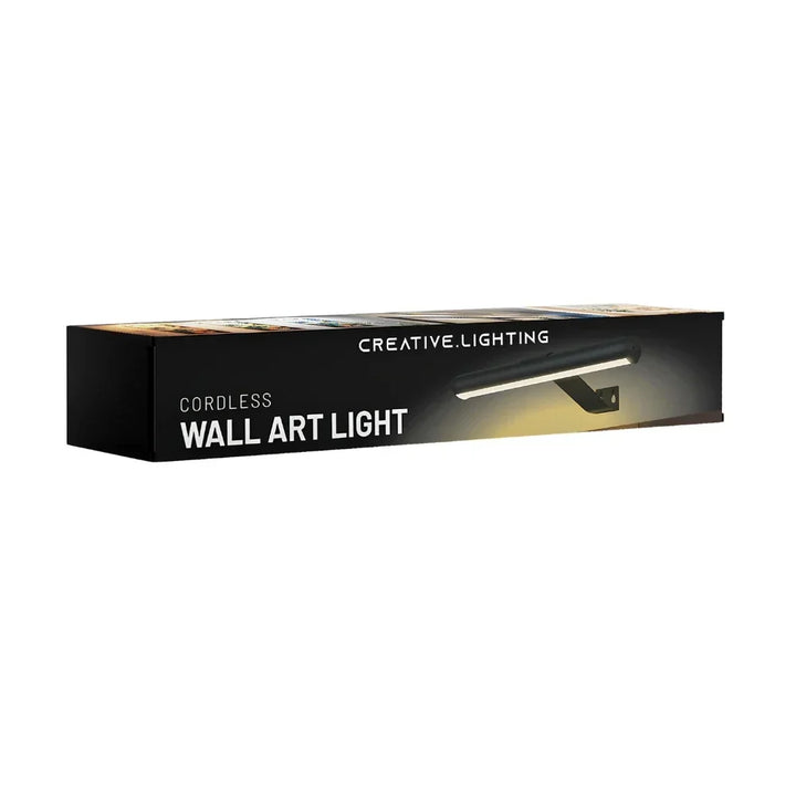Contemporary cordless LED picture light, dimmable with remote, for sophisticated art display.