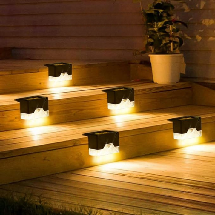 Waterproof solar LED step lights adhere to outdoor patio & deck stairs, providing bright, safe pathway lighting.