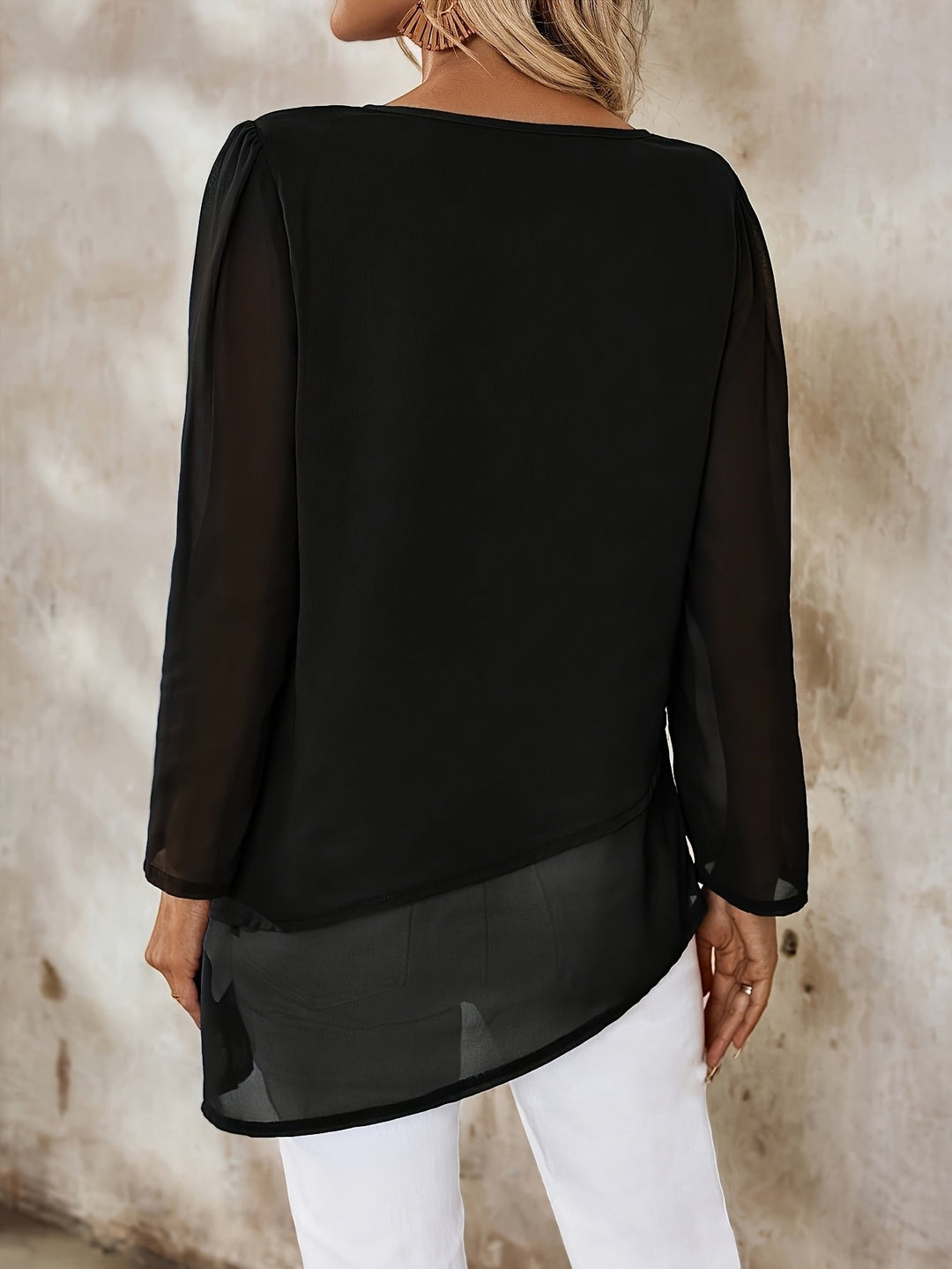 Black layered blouse for women, a relaxed fit long sleeve top for effortless style.