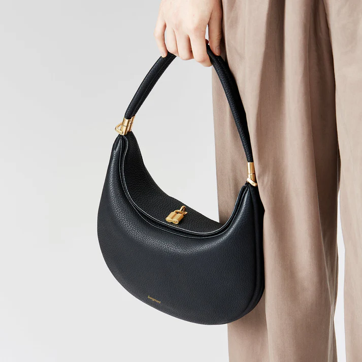 Elegant multi-strap women's handbag in synthetic leather, convertible to shoulder or crossbody bag.