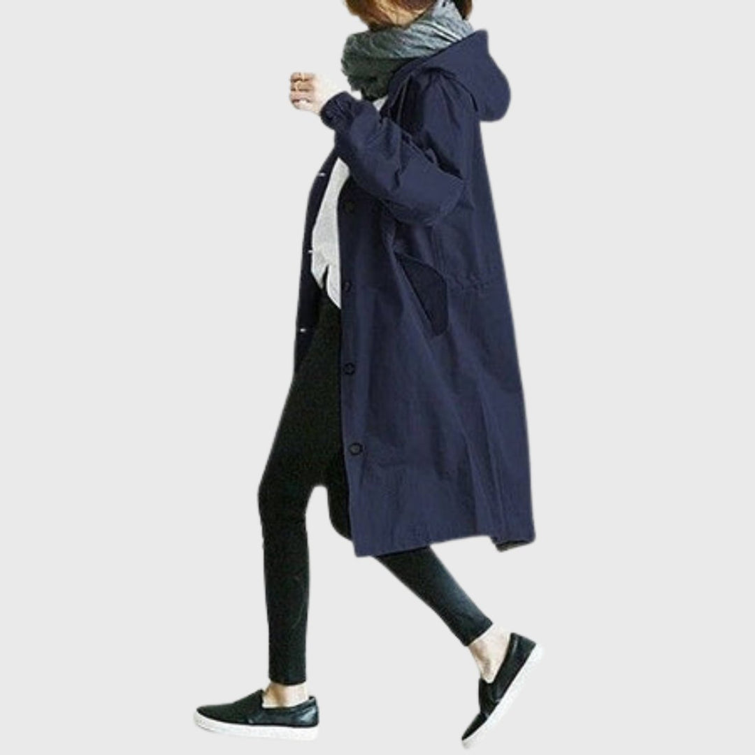 Chic women's long trench coat, hooded and water-resistant for relaxed fit & comfortable spring outerwear.