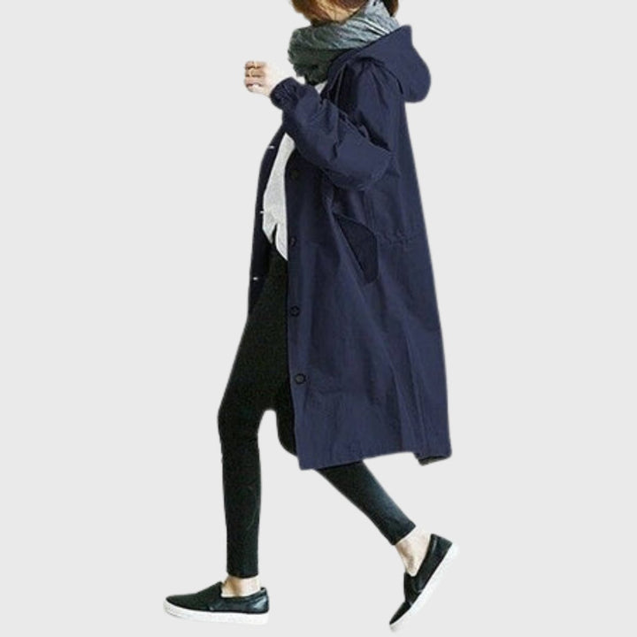 Chic women's long trench coat, hooded and water-resistant for relaxed fit & comfortable spring outerwear.