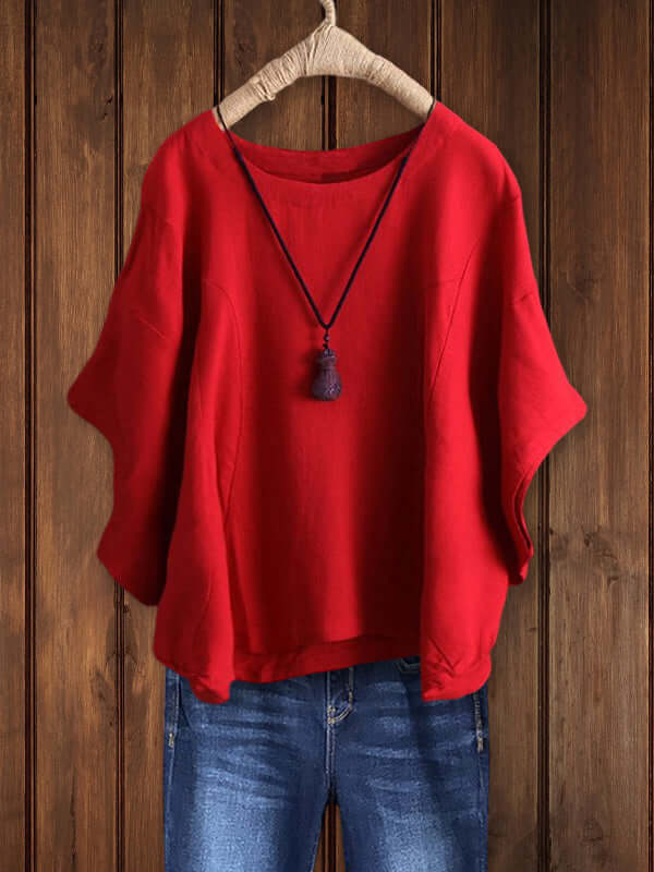 Spring women's crew-neck tunic top with stylish dolman sleeves. Comfortable, versatile casual wear for everyday style.