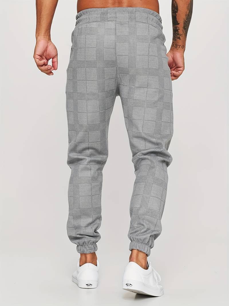 Men's checked jogger pants featuring a modern style, offering ultimate comfort for casual fashion.