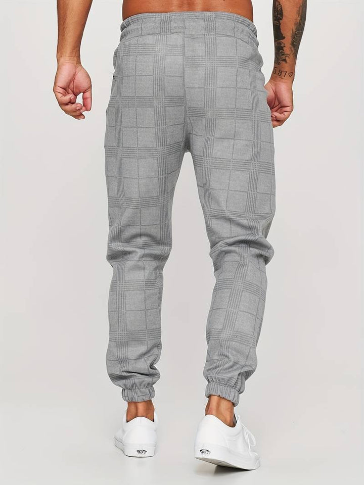 Men's checked jogger pants featuring a modern style, offering ultimate comfort for casual fashion.