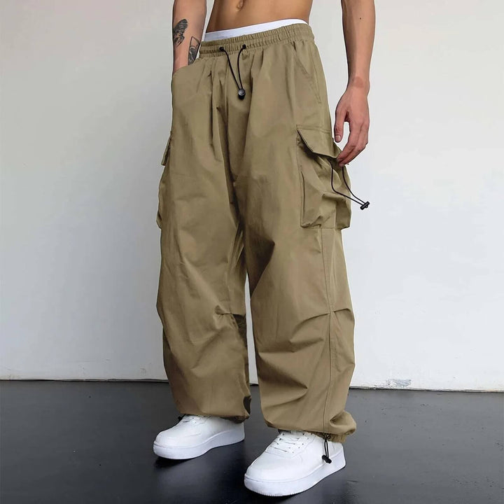 Men's multi-pocket cargo joggers, relaxed fit design in durable polyester for everyday comfort.