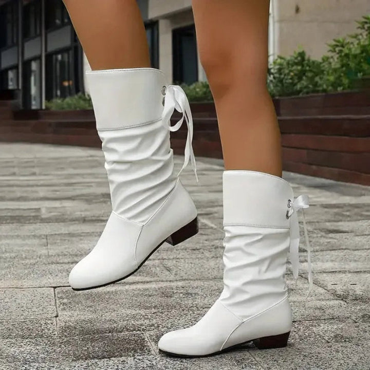 Fashionable women's slouchy ankle boots with lace-up front and stable block heel for trendsetters.